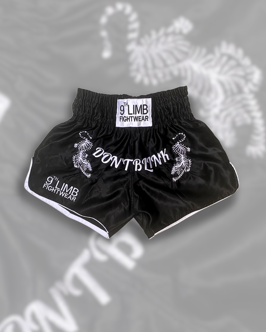 Black 9th Limb “Don’t Blink” Muay Thai Shorts – Black Satin Fightwear